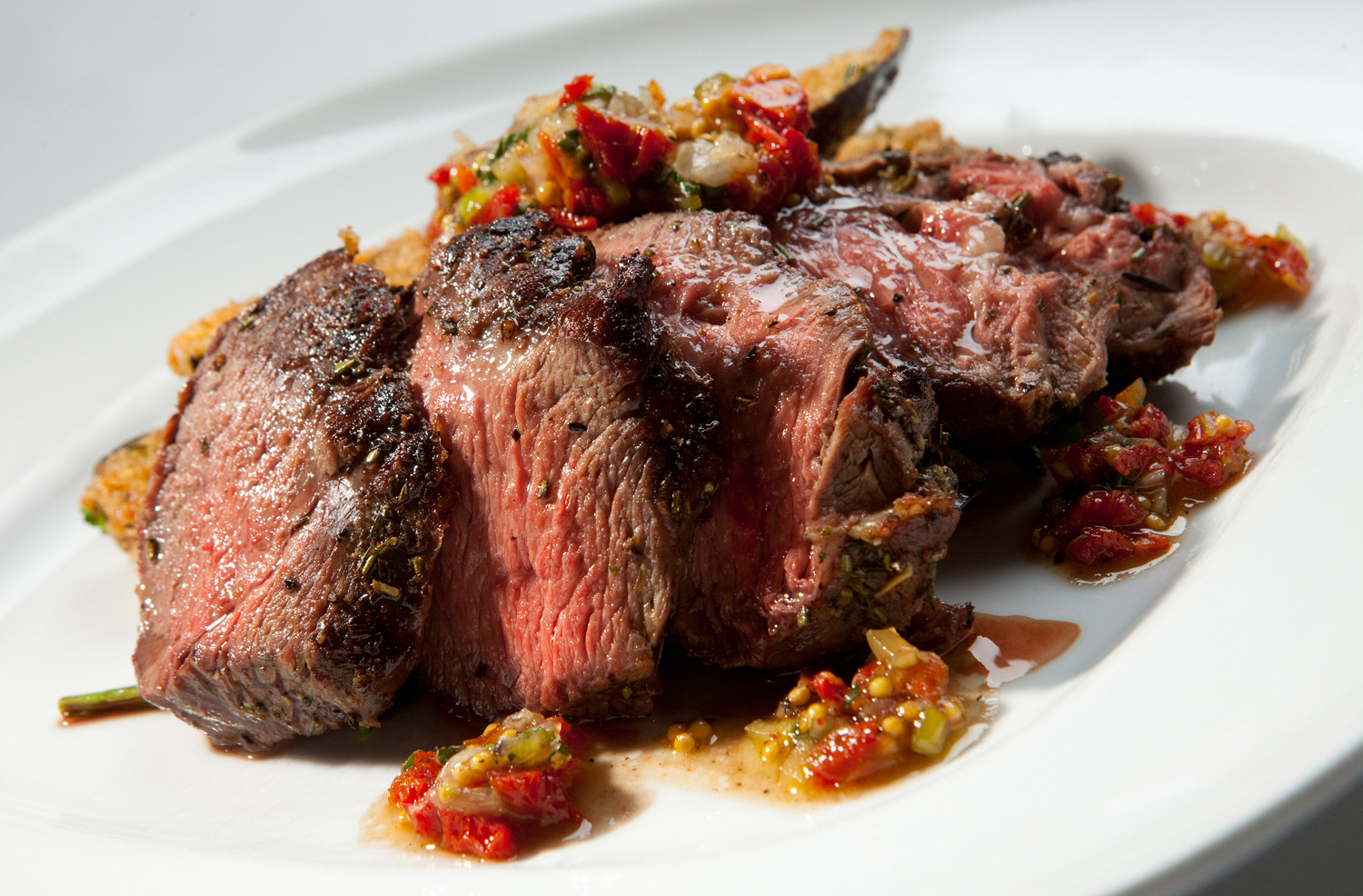 Rosemary Roasted Leg of Lamb with Sundried Tomato and Mint Relish