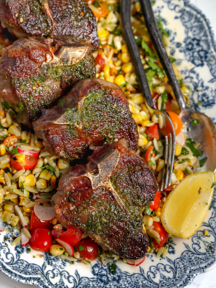 Grilled lamb loin chops with corn, orzo, tomatoes, radishes, and fresh herbs