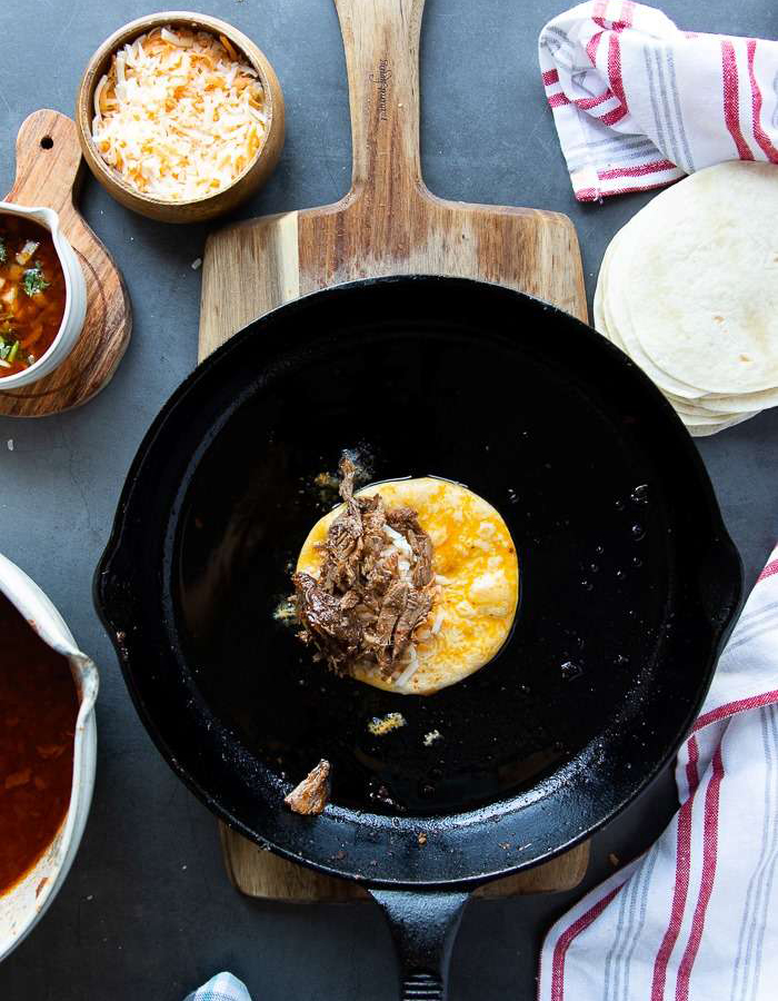 birria taco in a cast iron pan