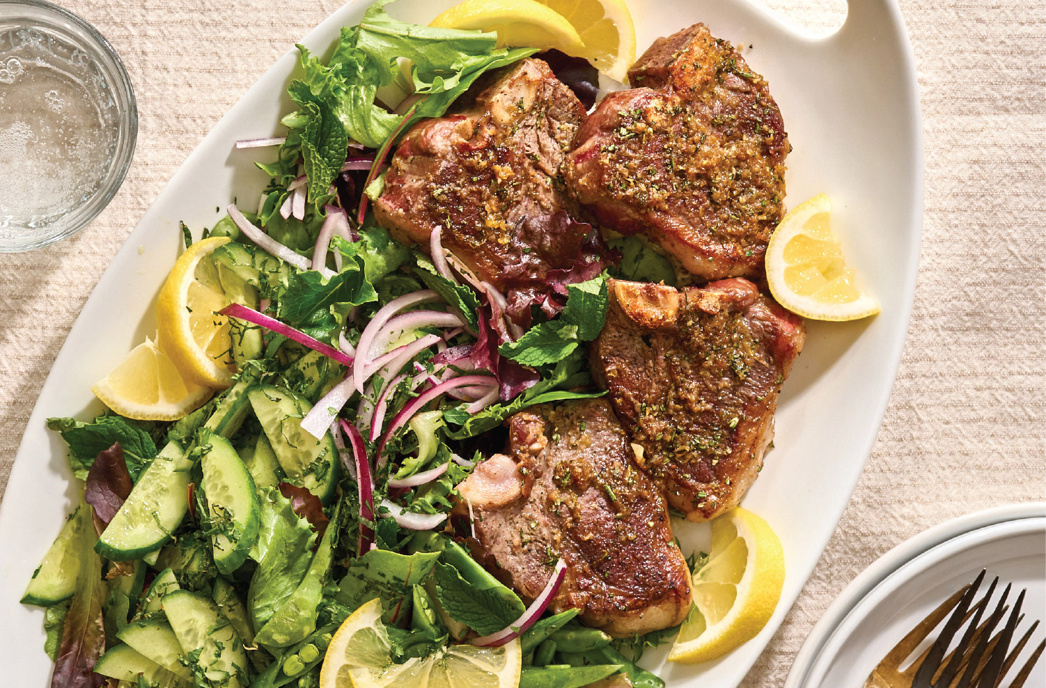 Lamb loin chops served with lemony mint salad and fresh greens.
