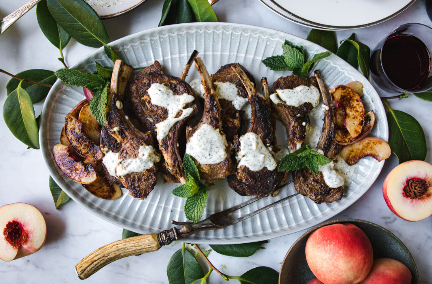 lamb rib chops with yogurt sauce and grilled peaches