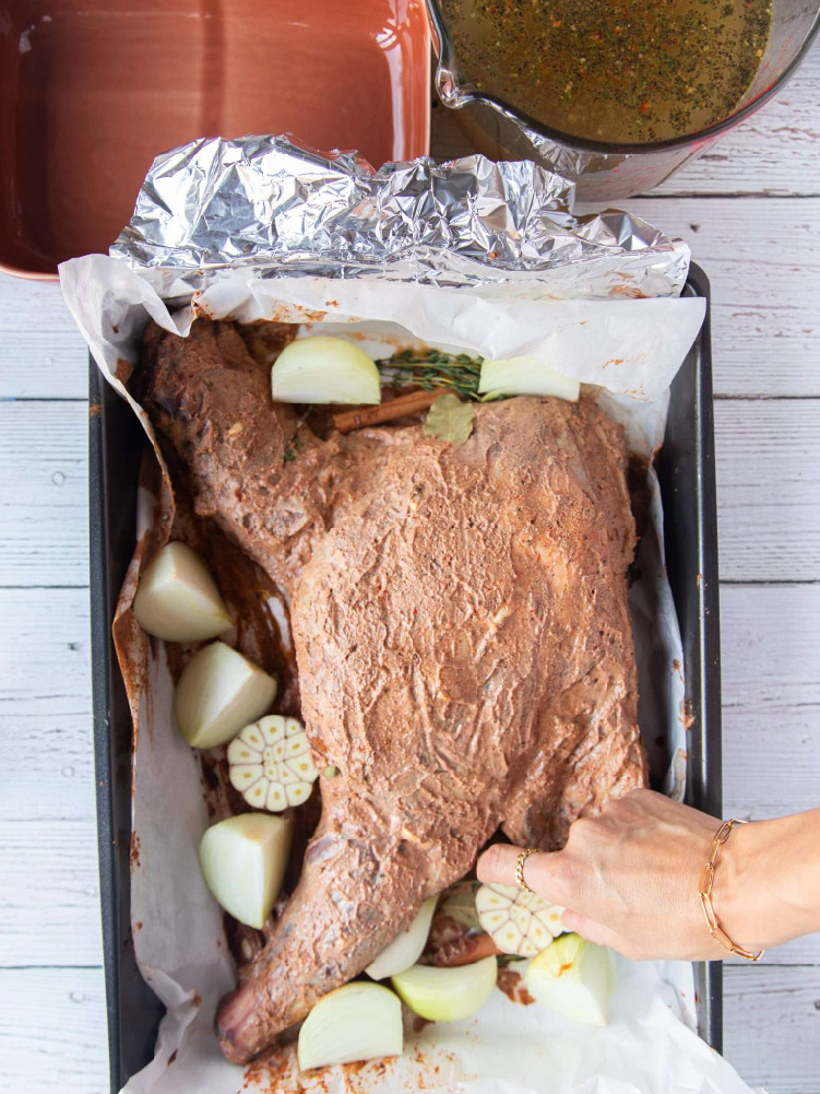 Lamb shoulder marinated with pomegranate molasses and spices before roasting